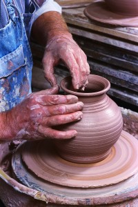 Potter Crafting Pot on Potter's Wheel
